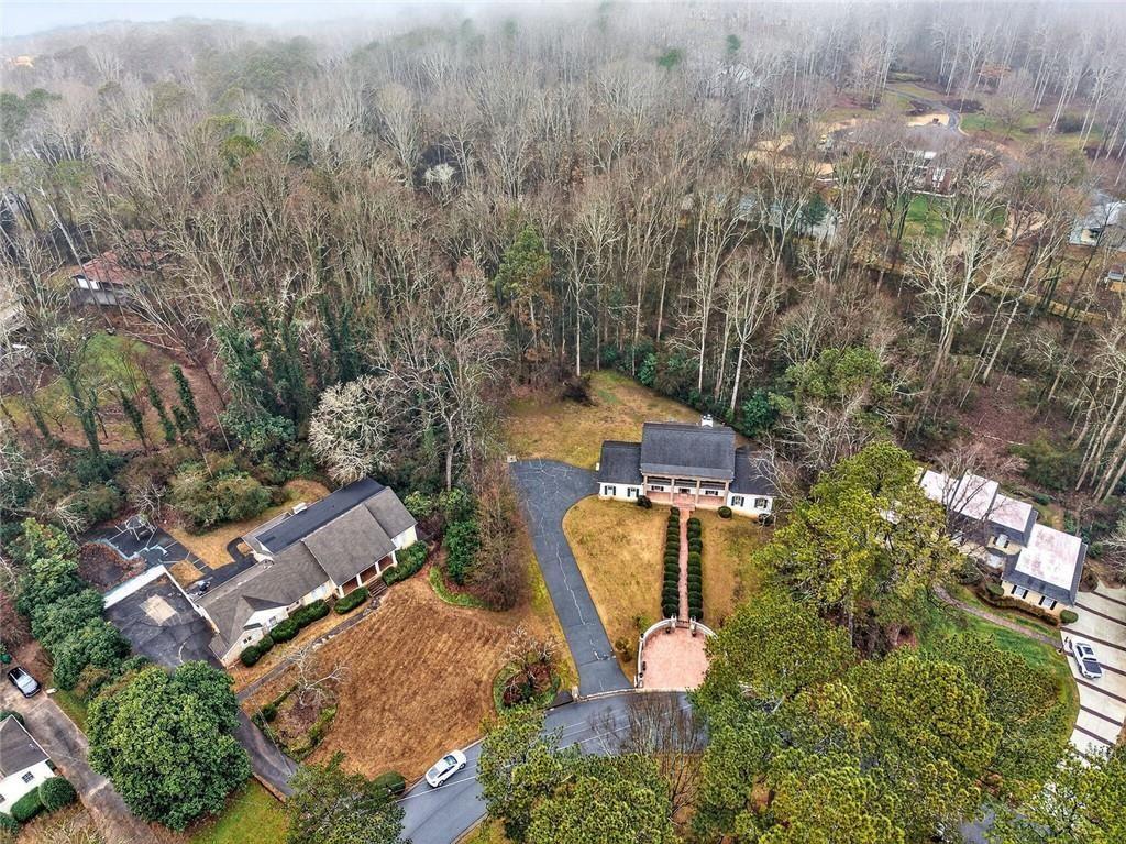 5523 Bahia Mar Circle Smoke Rise, GA 30087 - Photo 64 of 69 an aerial view of a house with a yard