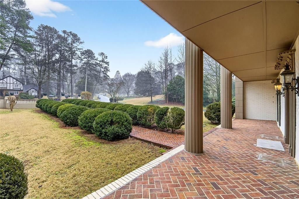 5523 Bahia Mar Circle Smoke Rise, GA 30087 - Photo 7 of 69 a view of a garden with pathway