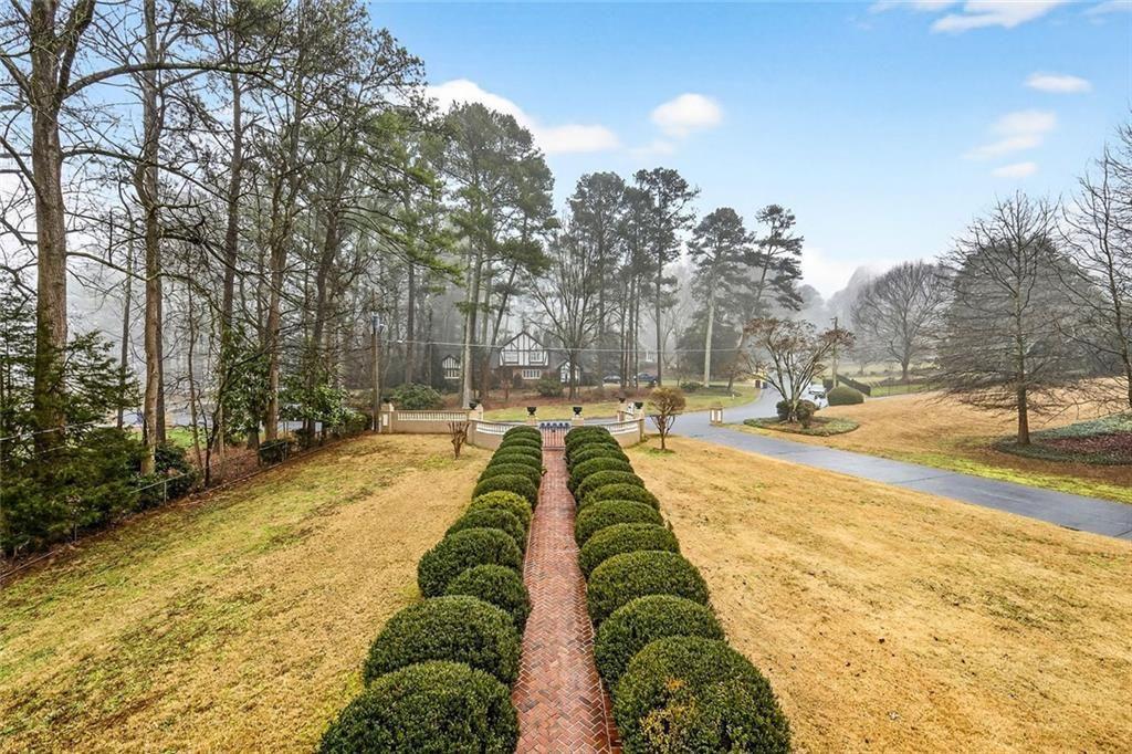 5523 Bahia Mar Circle Smoke Rise, GA 30087 - Photo 10 of 69 a view of swimming pool with outdoor seating and trees in the background