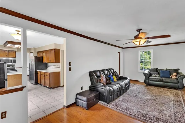 a kitchen with stainless steel appliances granite countertop a stove and a refrigerator