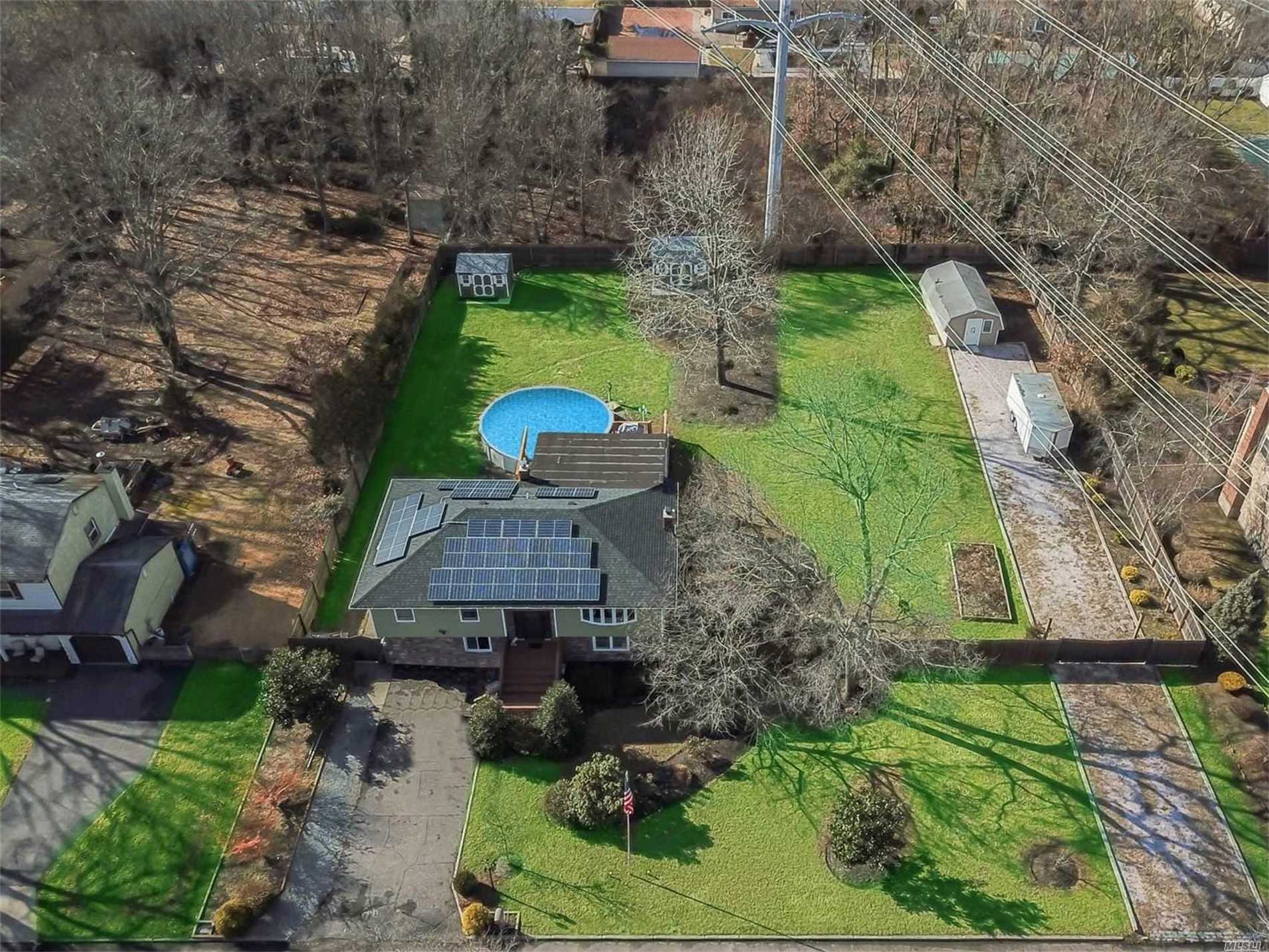 a aerial view of a house with a yard