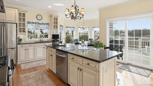 a kitchen with center island and windows