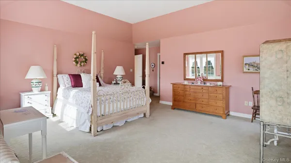 a bedroom with a bed and a cabinets