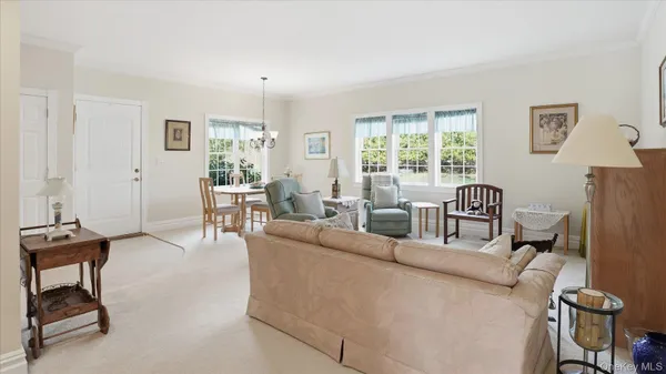 a bedroom with two beds and a dresser