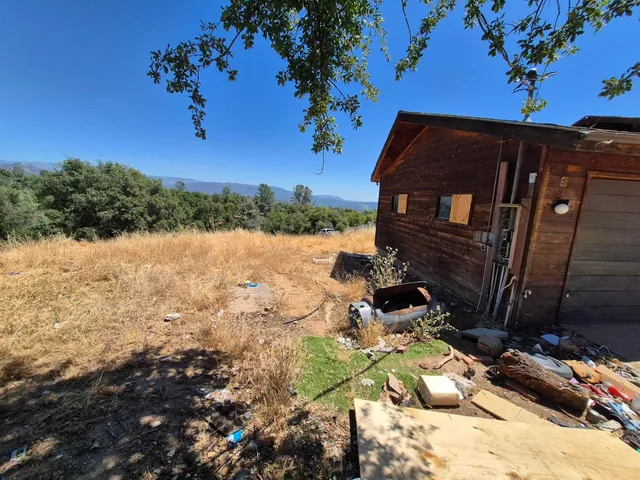 a view of a backyard of the house
