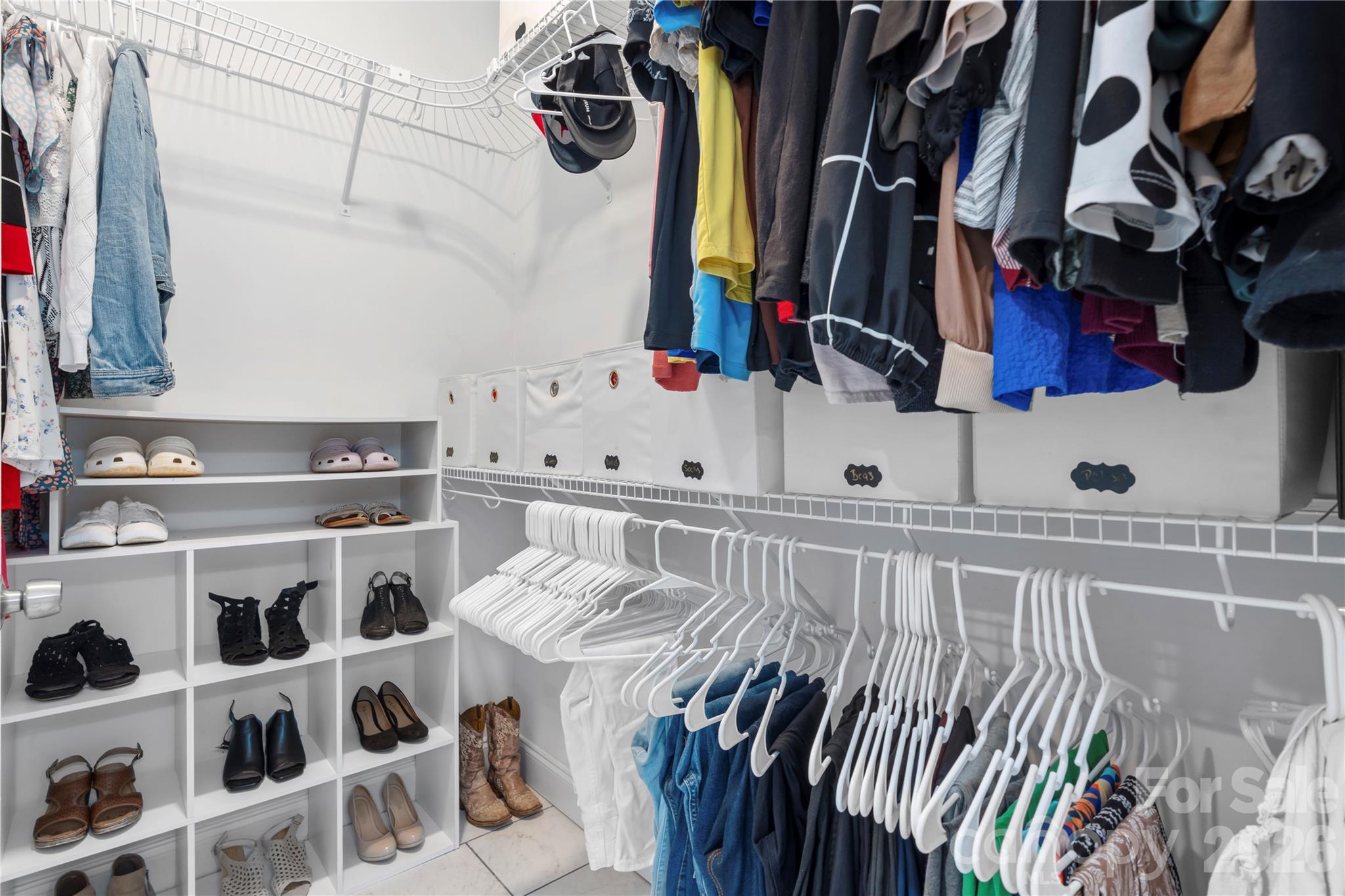 111 Pinewood Road Granite Falls, NC 28630 - Photo 18 of 33 a view of walk in closet with clothes and shoes