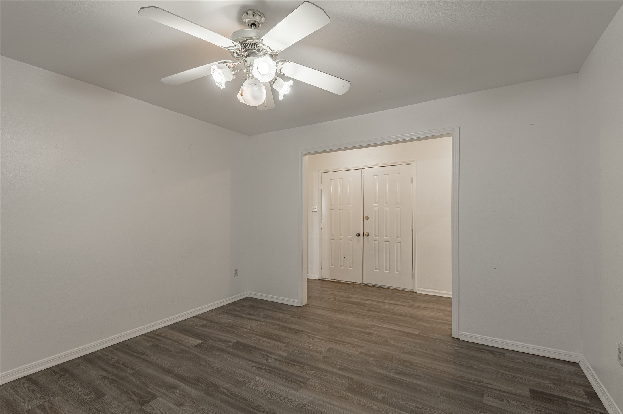 114 Timberline Drive Huntsville, TX 77320 - Photo 12 of 26 a view of an empty room with wooden floor