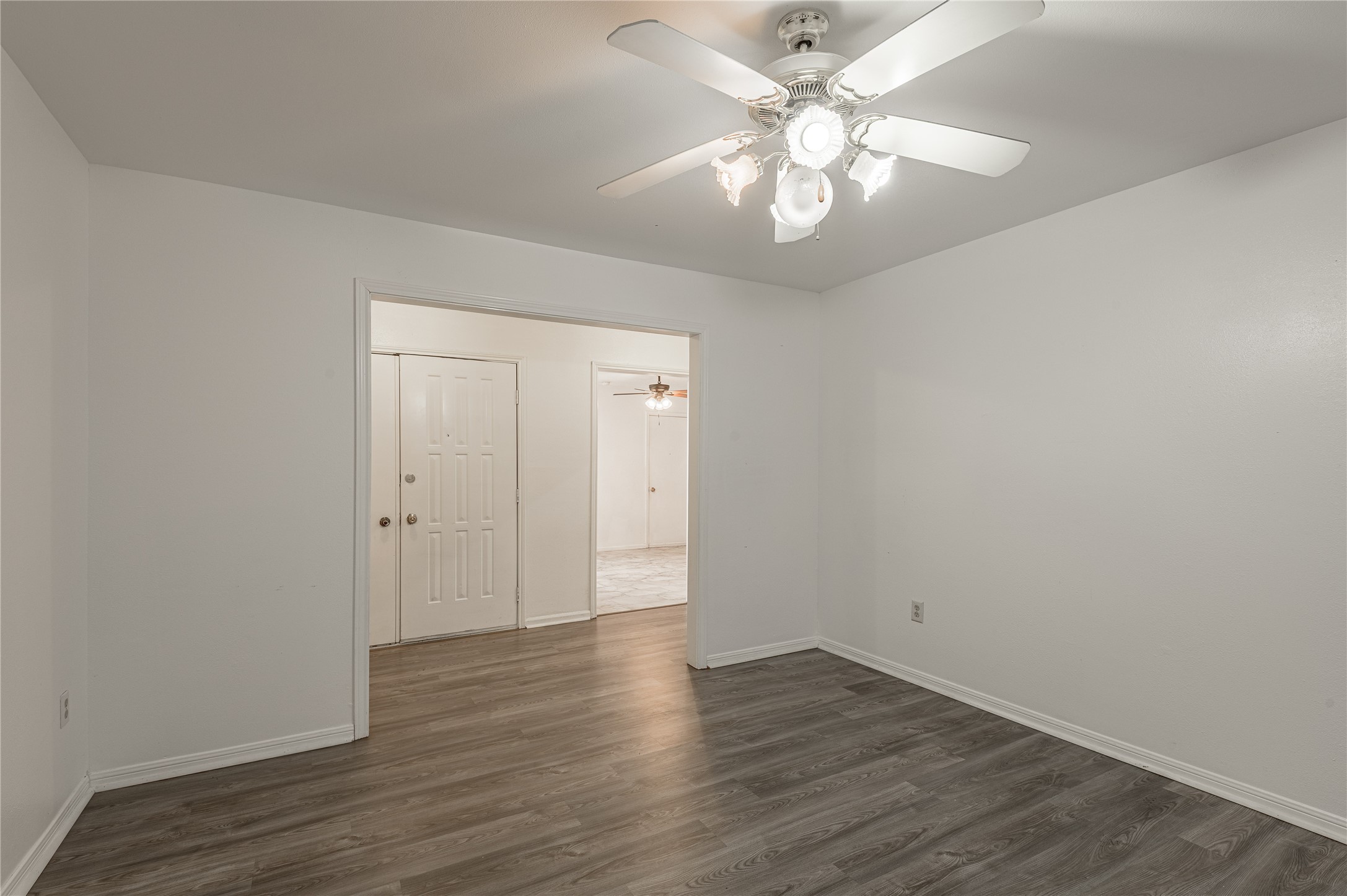 114 Timberline Drive Huntsville, TX 77320 - Photo 13 of 26 a view of an empty room with wooden floor