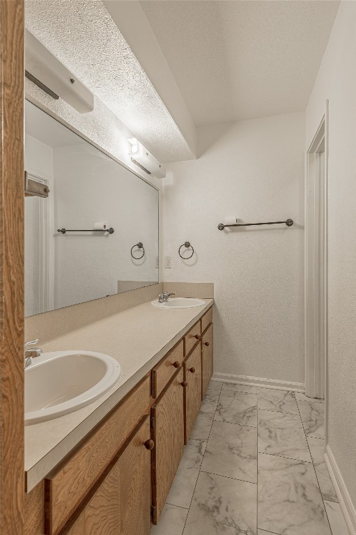 114 Timberline Drive Huntsville, TX 77320 - Photo 14 of 26 a bathroom with a granite countertop sink and a mirror