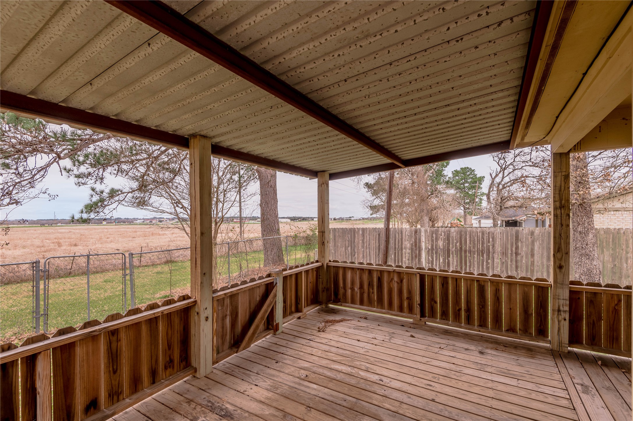 114 Timberline Drive Huntsville, TX 77320 - Photo 25 of 26 a view of a balcony with wooden floor