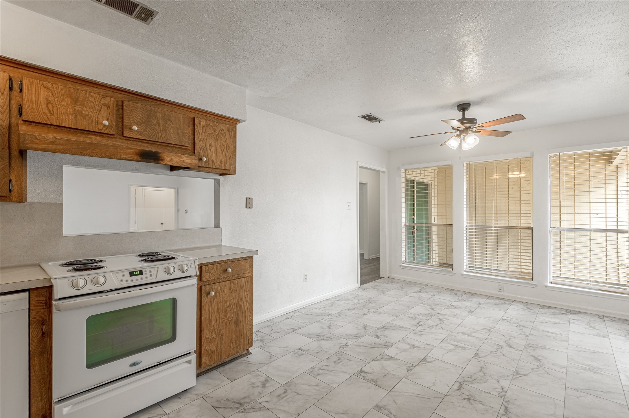 114 Timberline Drive Huntsville, TX 77320 - Photo 6 of 26 a view of a kitchen with a sink and a stove top oven