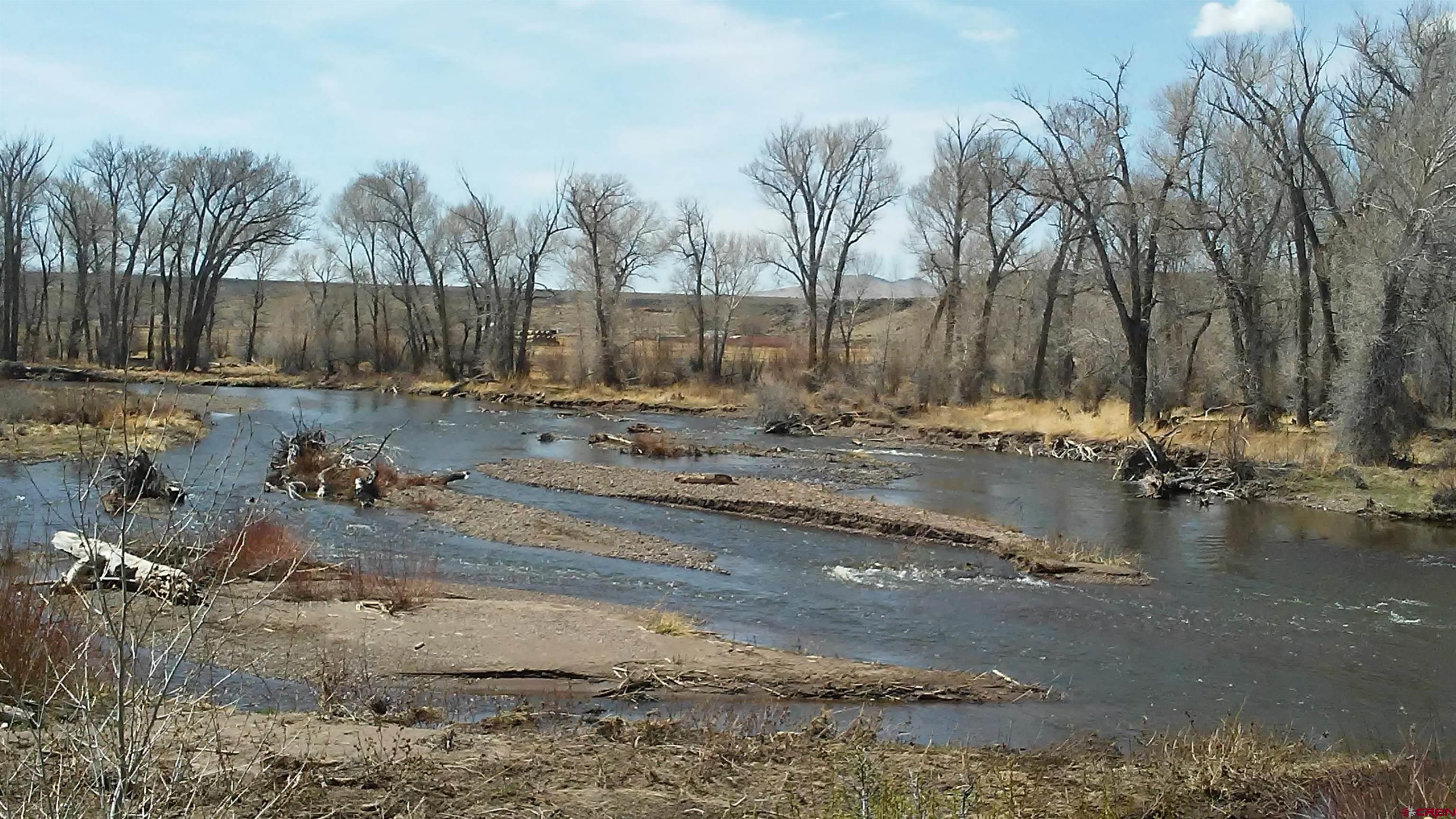 12753 13.5 Road Antonito, CO 81120 - Photo 16 of 39 a view of a backyard of the house