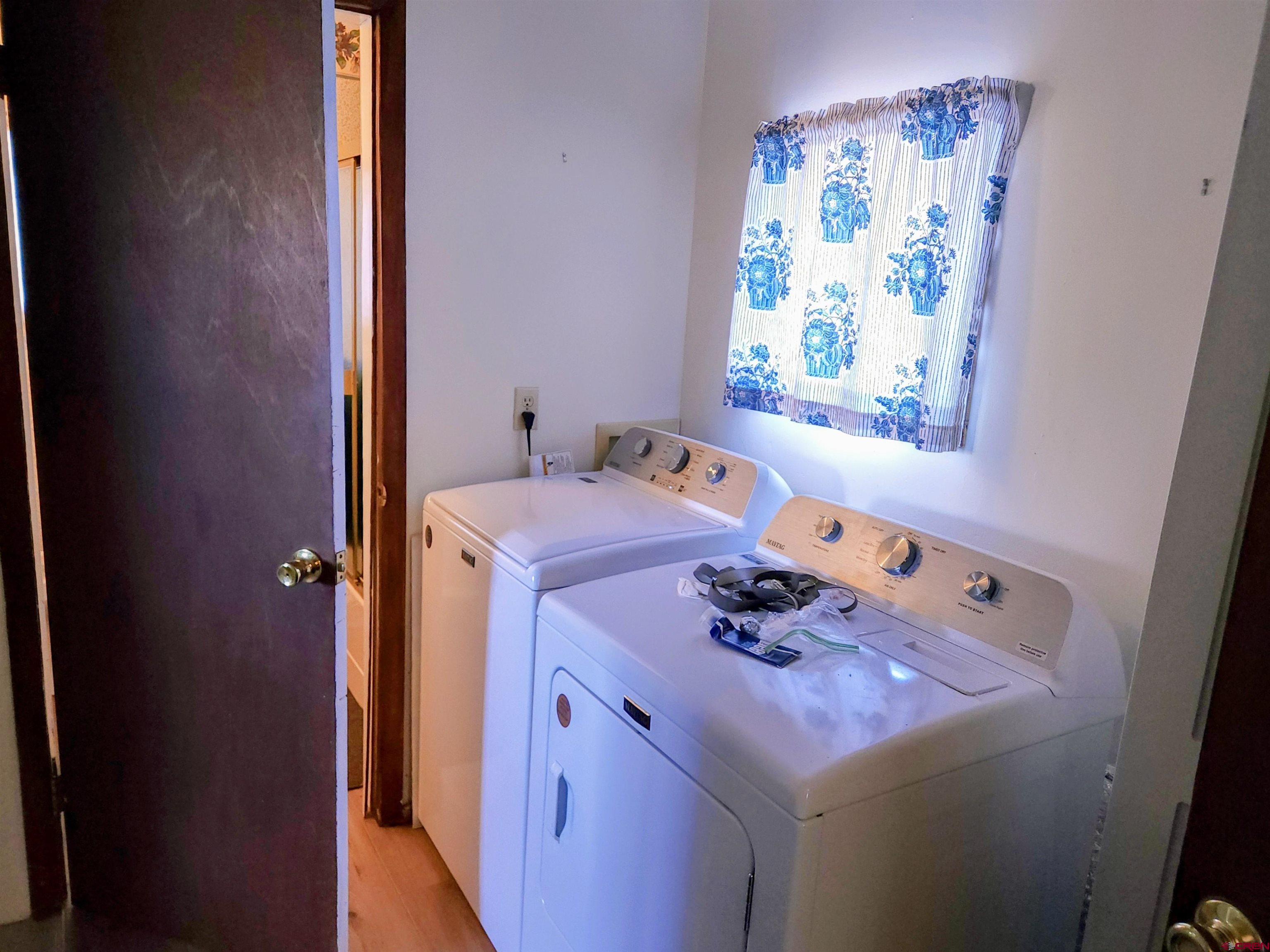 12753 13.5 Road Antonito, CO 81120 - Photo 17 of 39 a utility room with dryer and washer