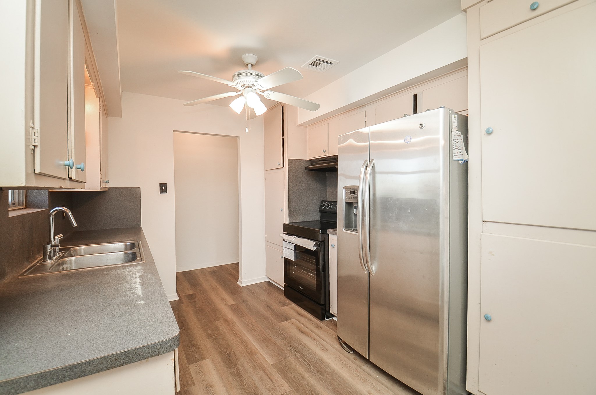 15573 Farm To Market 1887 Hempstead, TX 77445 - Photo 12 of 50 a kitchen with kitchen island a counter top space cabinets and stainless steel appliances