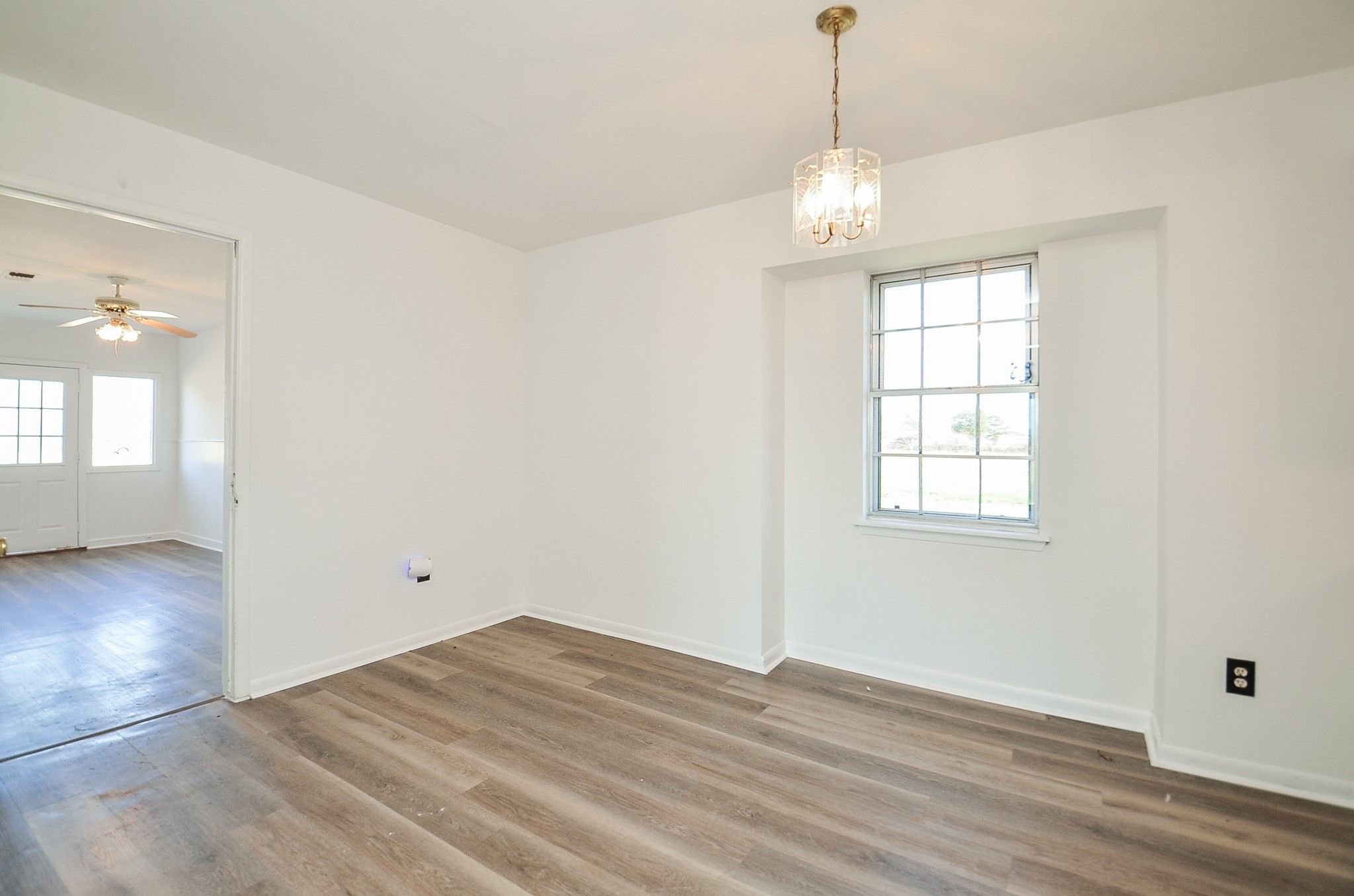 15573 Farm To Market 1887 Hempstead, TX 77445 - Photo 14 of 50 an empty room with wooden floor and windows