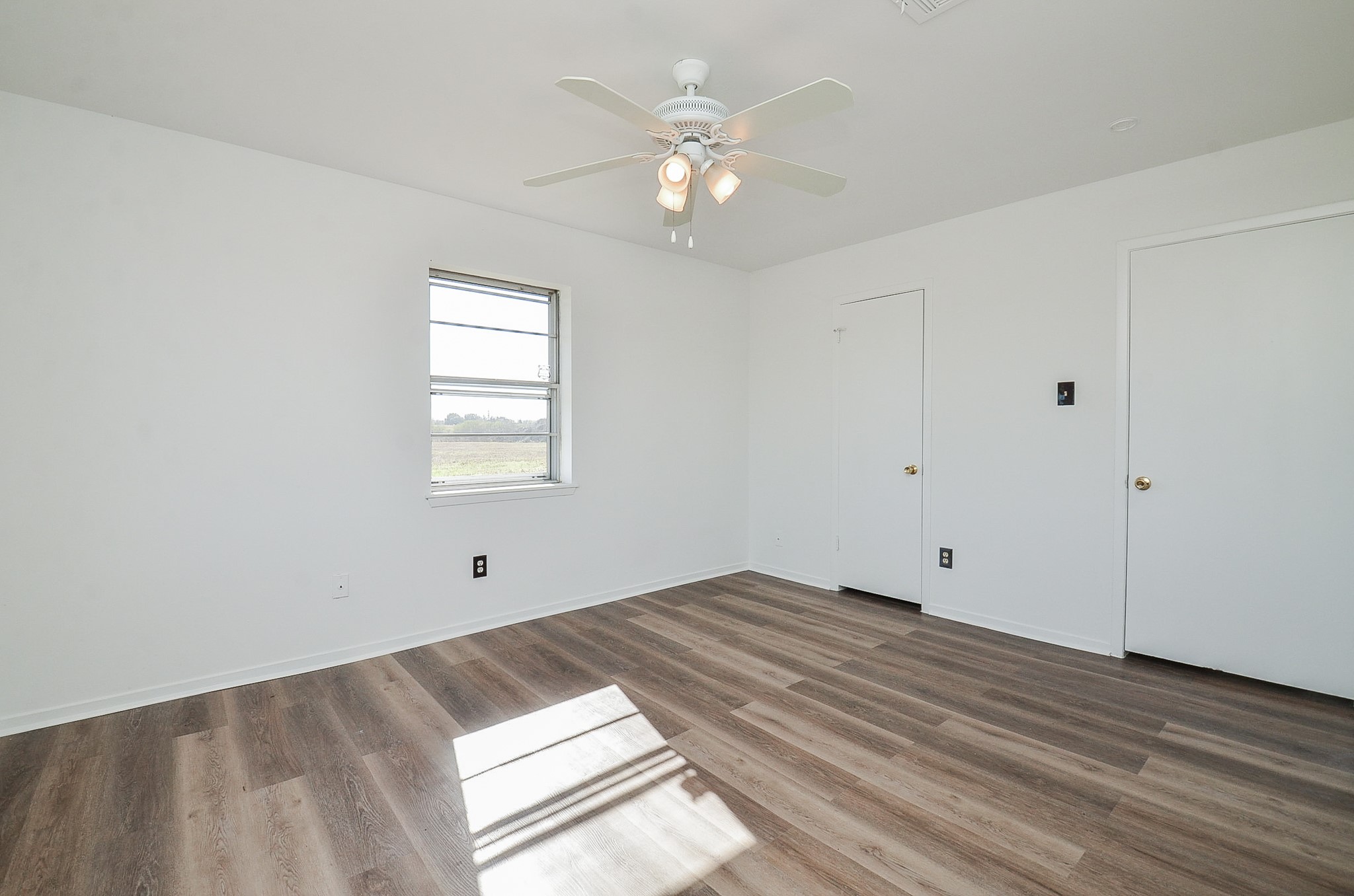 15573 Farm To Market 1887 Hempstead, TX 77445 - Photo 22 of 50 wooden floor in an empty room with a window