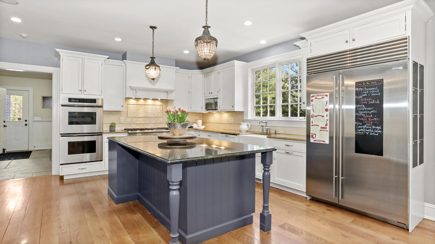 8 Wakeman Road Westport, CT 06880 - Photo 11 of 41 a kitchen with stainless steel appliances granite countertop a sink stove and refrigerator