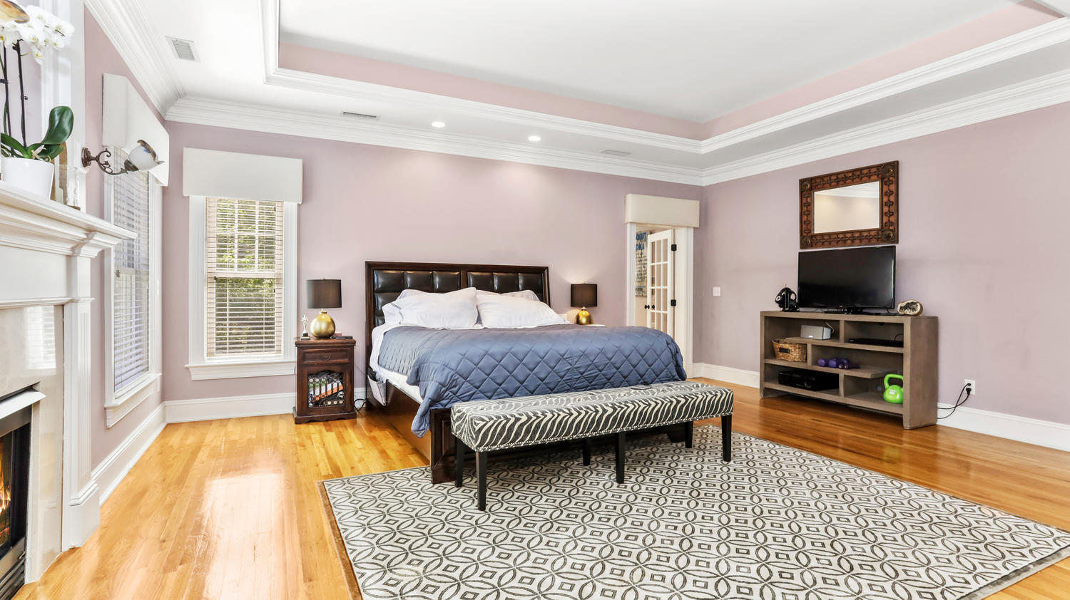 8 Wakeman Road Westport, CT 06880 - Photo 16 of 41 a bedroom with a bed and a flat screen tv