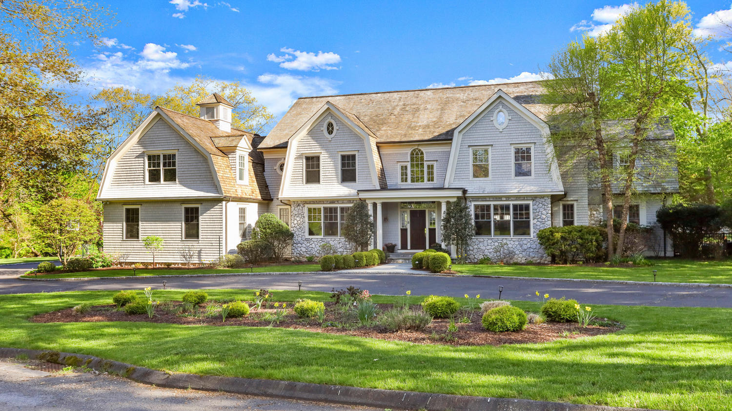 8 Wakeman Road Westport, CT 06880 - Photo 2 of 41 a view of a white house with a yard table and chairs