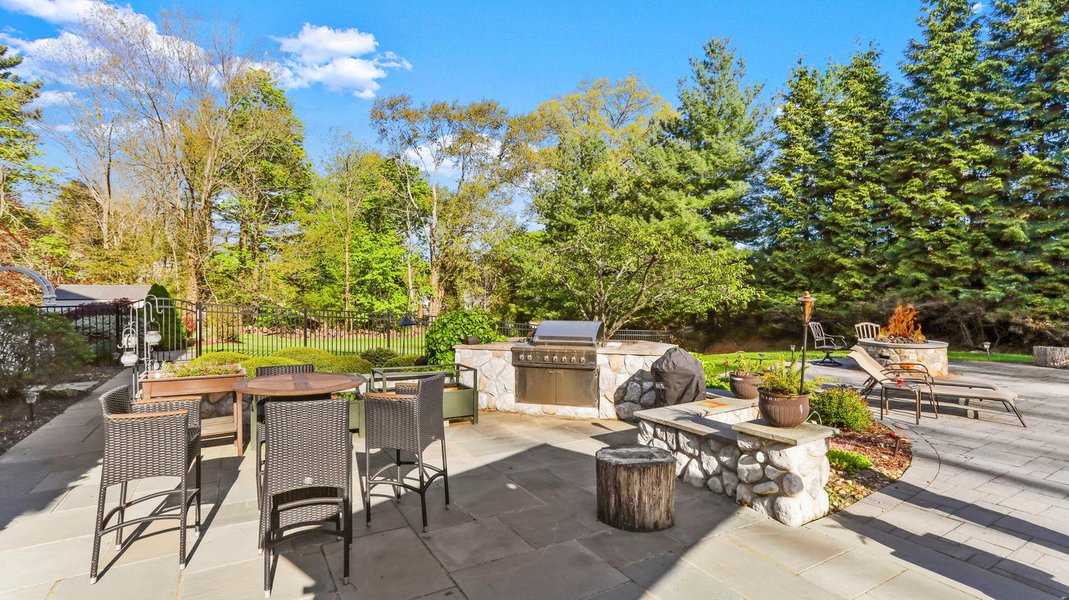 8 Wakeman Road Westport, CT 06880 - Photo 33 of 41 a view of a patio with table and chairs and potted plants