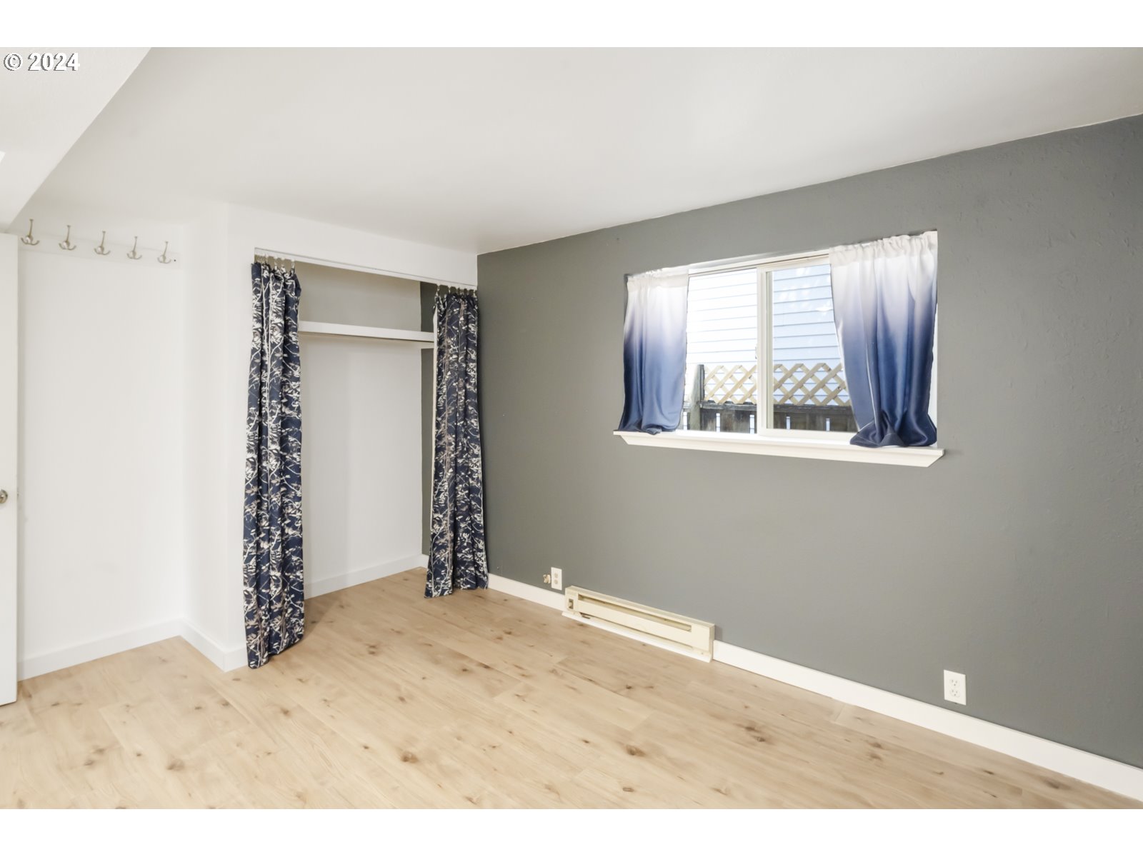 604 Northeast 93rd Avenue Portland, OR 97220 - Photo 13 of 34 a view of an empty room with window