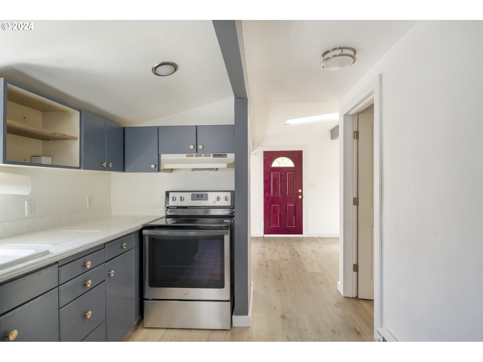 604 Northeast 93rd Avenue Portland, OR 97220 - Photo 19 of 34 a kitchen with a stove and a microwave