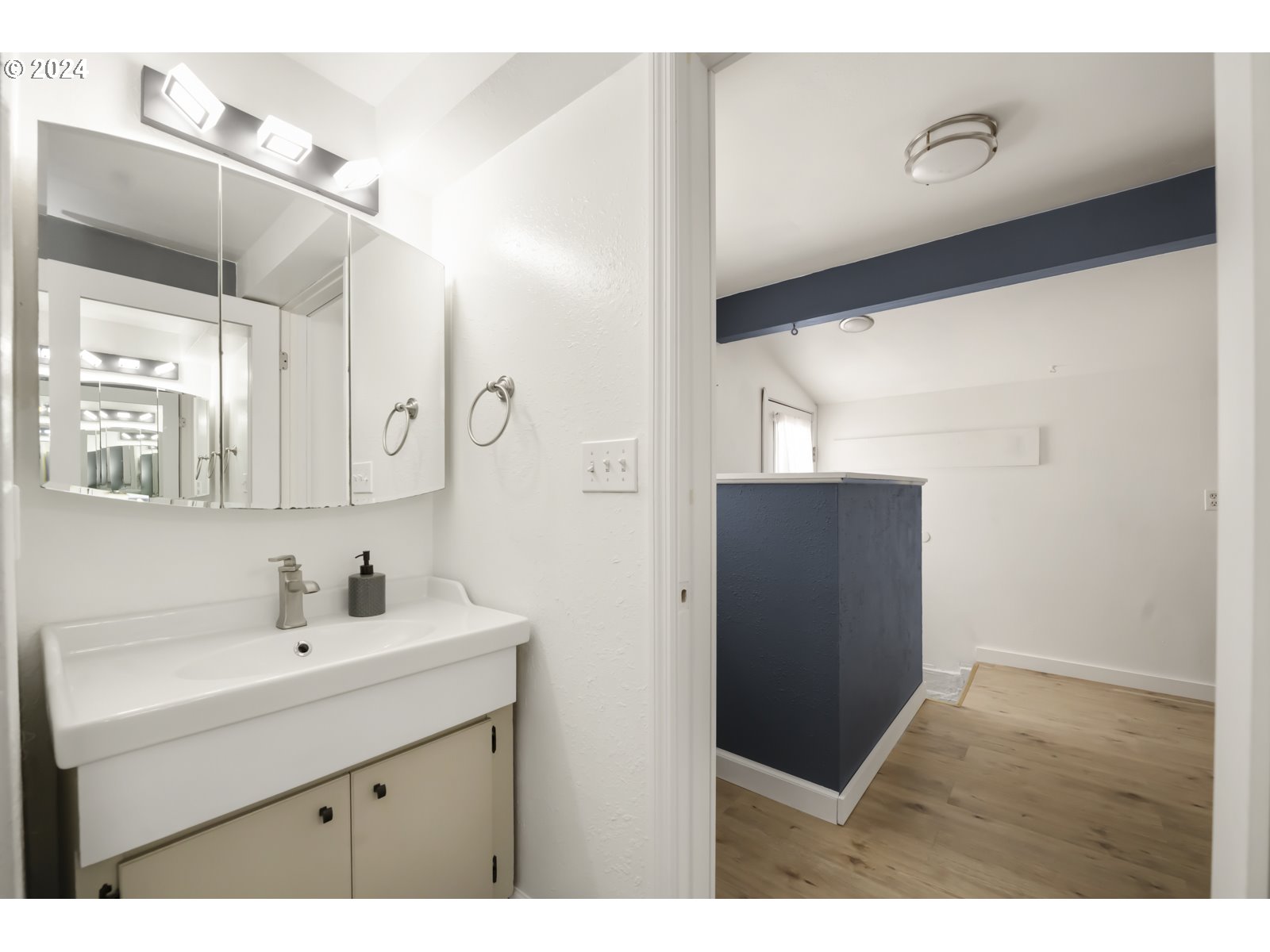604 Northeast 93rd Avenue Portland, OR 97220 - Photo 22 of 34 a bathroom with a sink and mirror