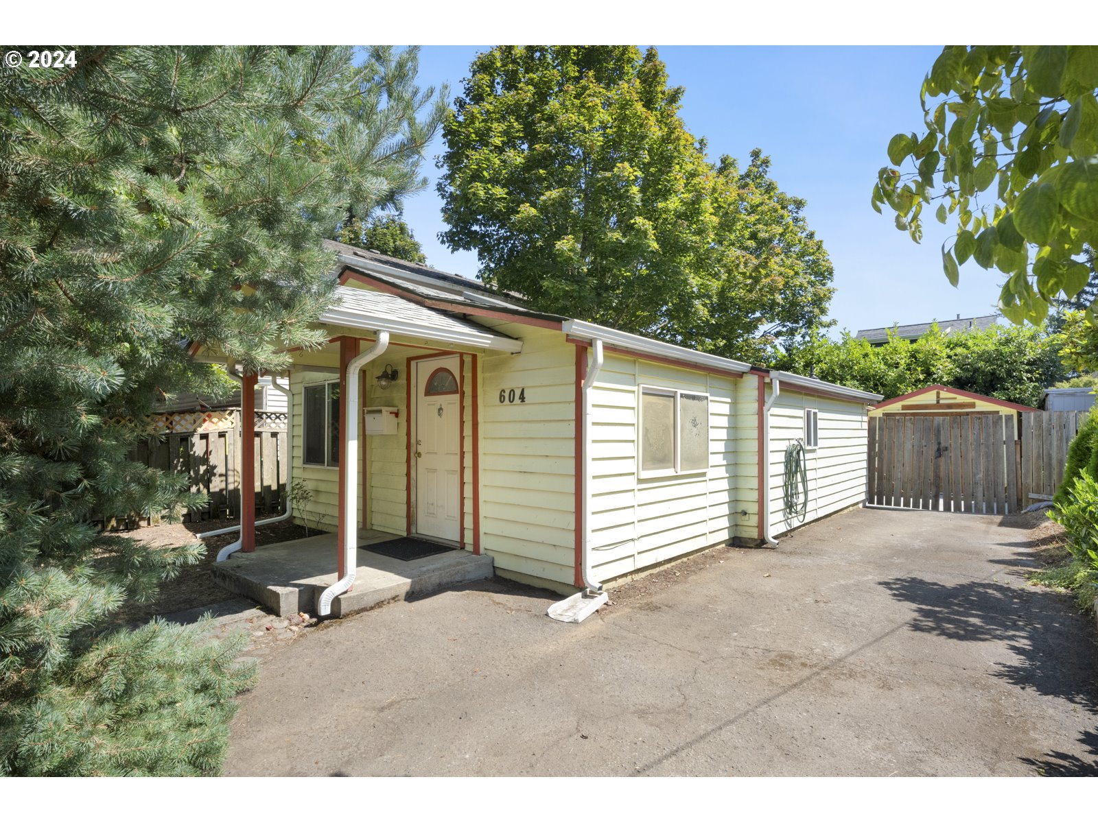 604 Northeast 93rd Avenue Portland, OR 97220 - Photo 3 of 34 a house with a outdoor space