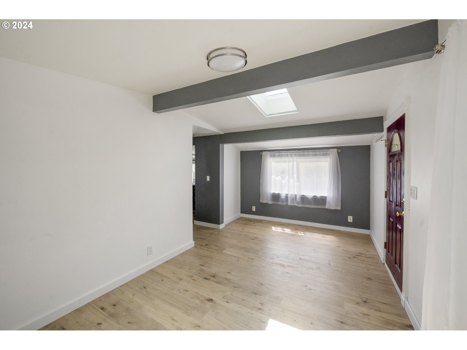 604 Northeast 93rd Avenue Portland, OR 97220 - Photo 8 of 34 a view of a room with window and hardwood floor