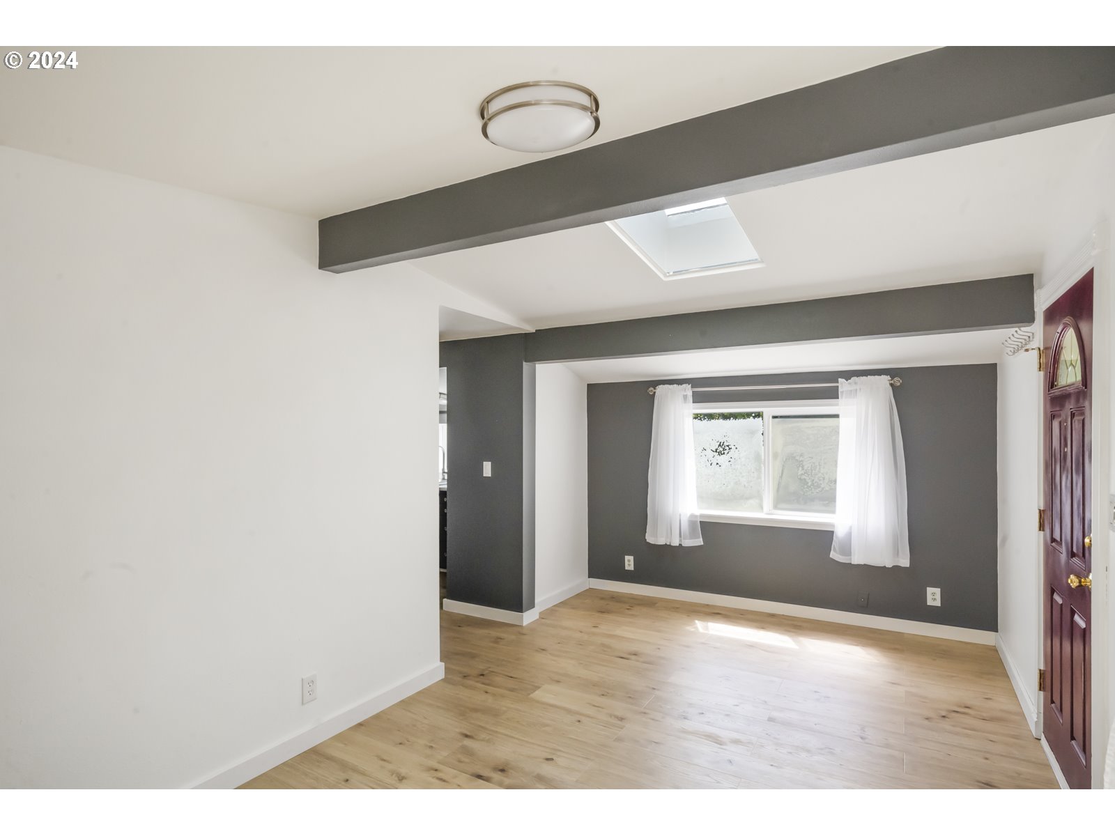 604 Northeast 93rd Avenue Portland, OR 97220 - Photo 9 of 34 a view of an empty room and window
