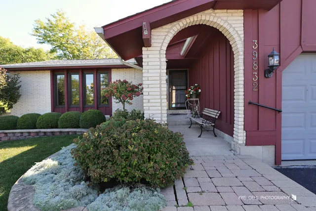 a view of a chairs and tables in the balcony