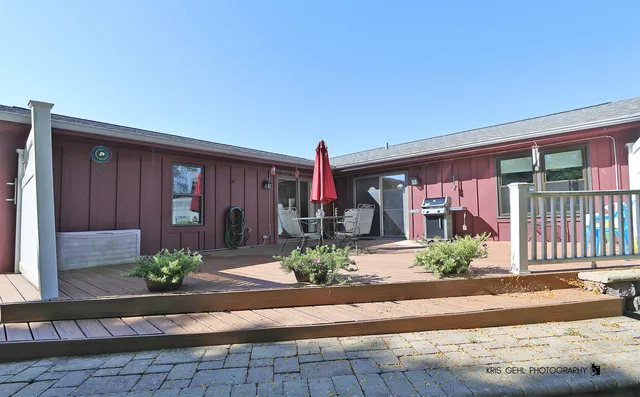 a front view of a house with potted plants