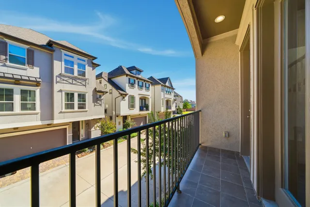 a view of a street from a balcony