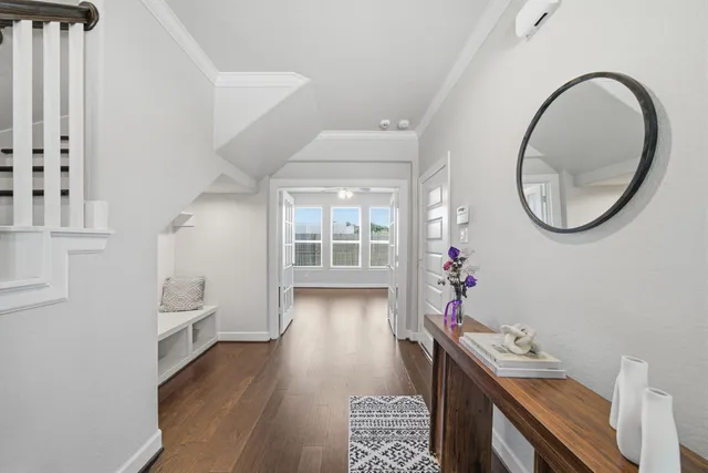 a very nice looking room with wooden floor and a window