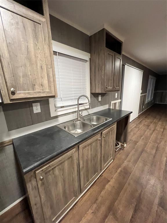 197 Sweden Street Walnut Springs, TX 76690 - Photo 11 of 27 a kitchen with stainless steel appliances granite countertop a sink stove and cabinets