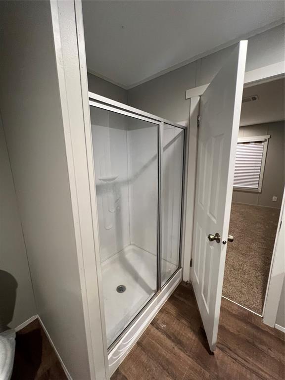 197 Sweden Street Walnut Springs, TX 76690 - Photo 21 of 27 a bathroom with a glass door shower