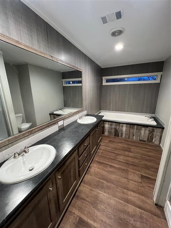 197 Sweden Street Walnut Springs, TX 76690 - Photo 24 of 27 a bathroom with a sink and a mirror