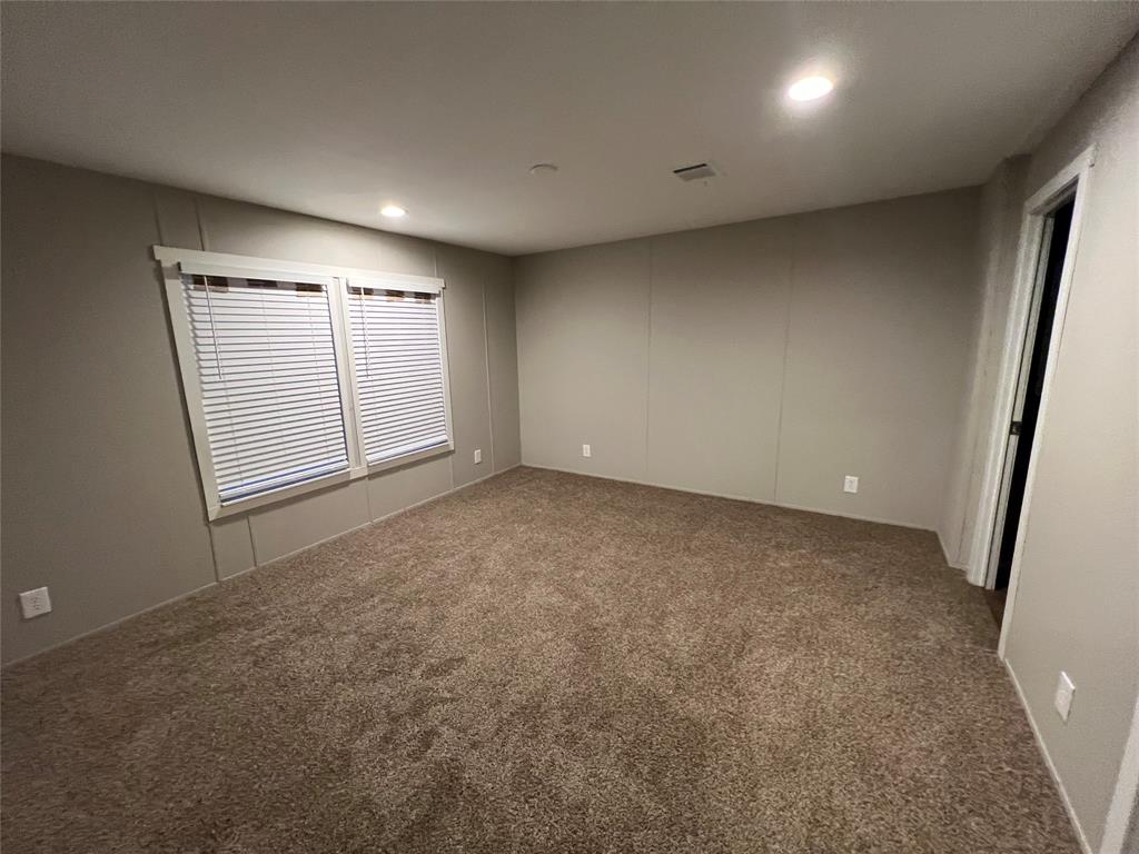 197 Sweden Street Walnut Springs, TX 76690 - Photo 27 of 27 an empty room with windows