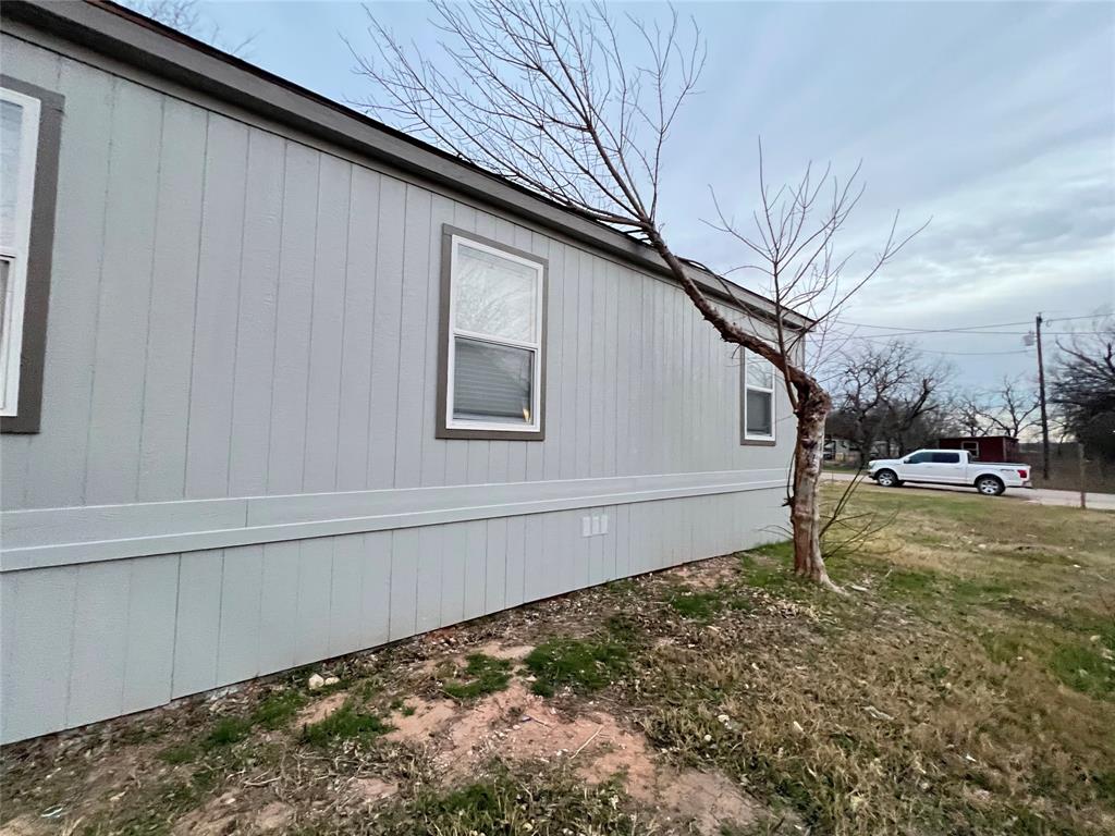 197 Sweden Street Walnut Springs, TX 76690 - Photo 3 of 27 a view of a backyard of the house