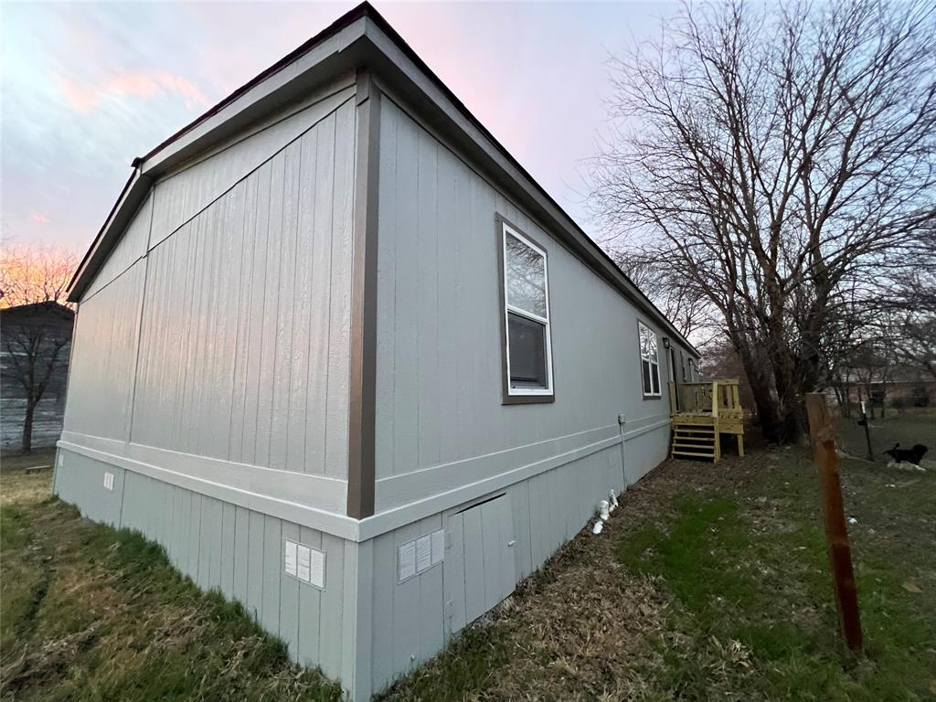 197 Sweden Street Walnut Springs, TX 76690 - Photo 4 of 27 a view of backyard of house