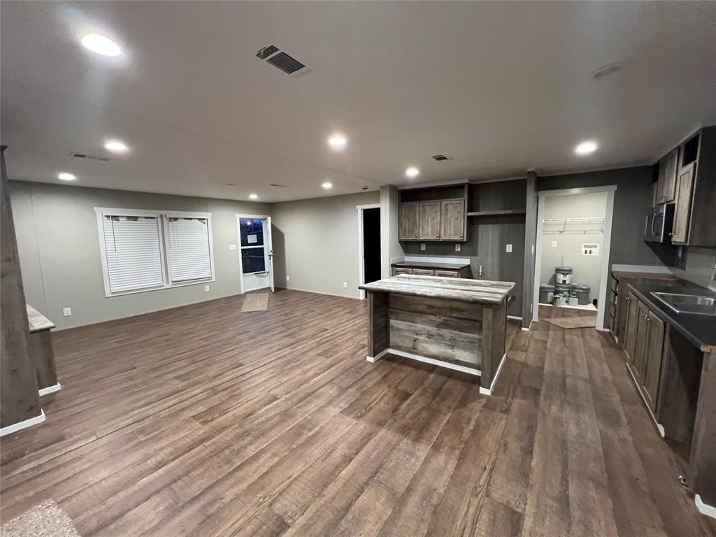 197 Sweden Street Walnut Springs, TX 76690 - Photo 7 of 27 a view of kitchen with sink and refrigerator