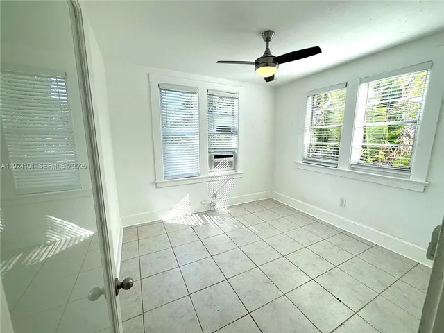 a bathroom with a toilet sink and shower