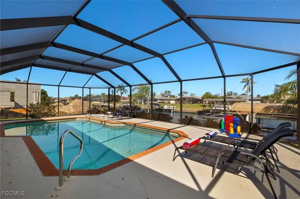 a view of a swimming pool with a lounge chairs