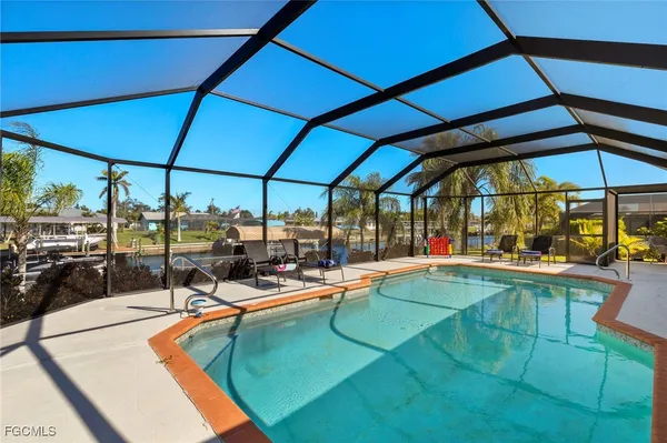 a view of a swimming pool with a patio