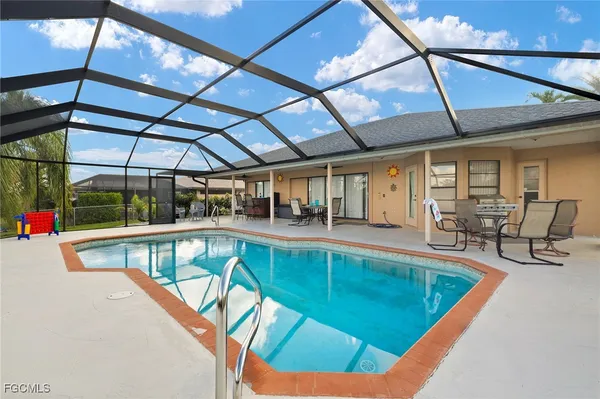 a view of a swimming pool with a patio