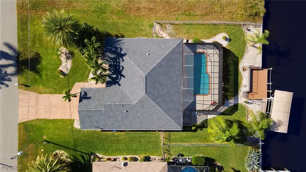 an aerial view of a house with a swimming pool