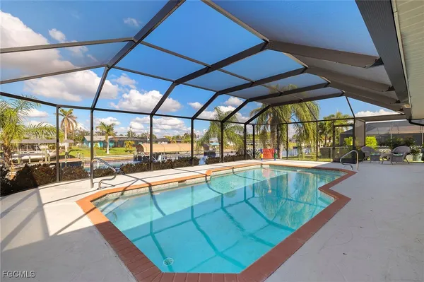 a view of a swimming pool with a porch