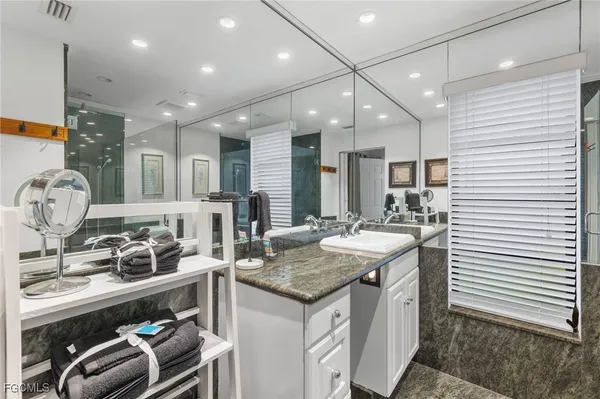 a kitchen with sink stove and cabinets