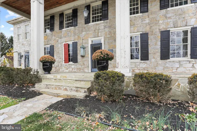 a view of entryway with wooden floor and stairs