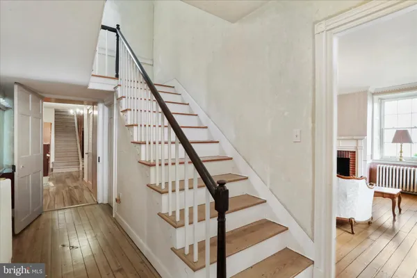 a living room with furniture a rug and a chandelier